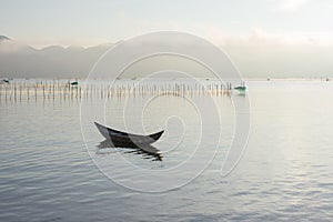 Small fishing boats refection on the fjord part 3