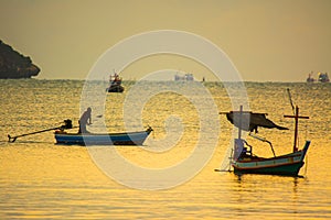 Small fishing boats in  the sea sea in Twilight time