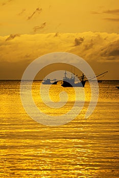 Small fishing boats in  the sea sea in Twilight time