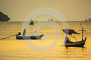 Small fishing boats in  the sea sea in Twilight time