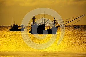 Small fishing boats in  the sea sea in Twilight time