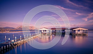 Small fishing houses on stilts on the lake Mesologgi