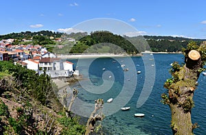 Small fishing village with boats and beach. Redes, Galicia, Spain. photo