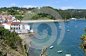 Small fishing village with boats and beach. Redes, Galicia, Spain. photo