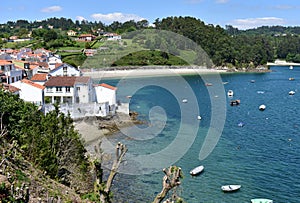 Small fishing village with boats and beach. Redes, Galicia, Spain. photo