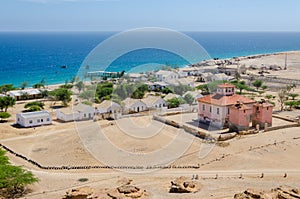 Small fishing village Mucuio with dominating Portuguese colonial building in Angola