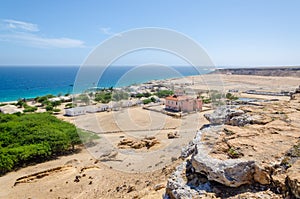 Small fishing village Mucuio with dominating Portuguese colonial building in Angola