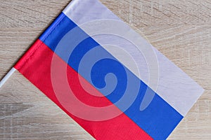 Small flag of Russian Federation on the wooden table