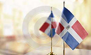 Small flags of the Dominicana on an abstract blurry background