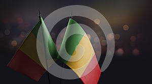 Small flags of the Mali on an abstract blurry background