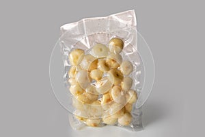Small flat onions in vacuum packed