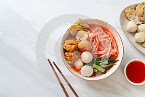 Small flat rice noodles with fish balls and shrimp balls in pink soup, Yen Ta Four or Yen Ta Fo