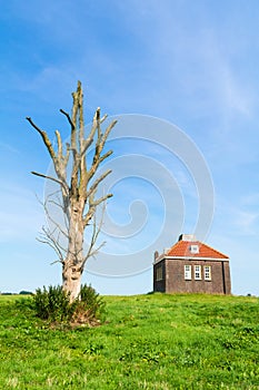Small foghorn house in harbour of former island Schokland, Netherlands
