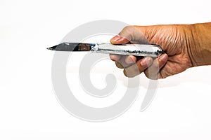 Small folding stainless steel knife in man hand