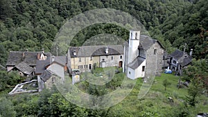 Small forgotten traditional village and church, lost on the Italian Swiss Alps near Locarno