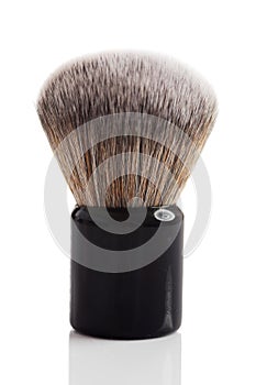 Small foundation makeup brush isolated on white