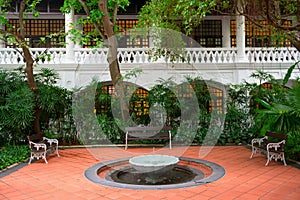 Small fountain in a garden with benches