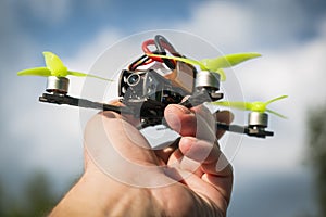 Small FPV drone in a man`s hand