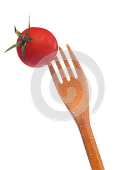 Small Fresh Juicy Red Tomato Placed Pirced On Plastic Disposable Fork Isolated on White Background