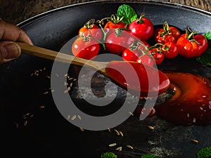 Small fresh tometo Sauce on pan.