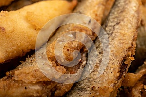 Small fried fish, surface texture, background image, close-up, selective focus
