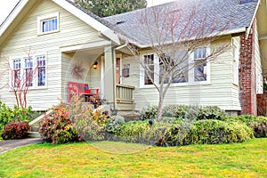 Small front porch with red bench