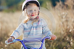 Small funny kid with bike