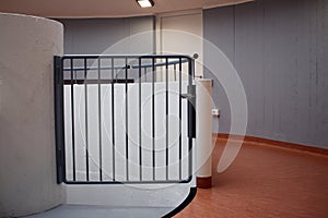 Small gate closed in a corridor