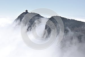 A small gazebo on the top of the majestic cliff of Emai Mountains in Sichuan province in China