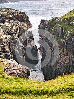 A small geo, or inlet, near Culswick Broch on the west of Mainland Shetland, UK.