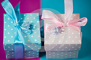 Small gift in blue and pink wrapping, newborn, birthday