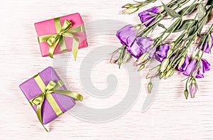 Small gift boxes and flowers. Gift on a white background. Copy space