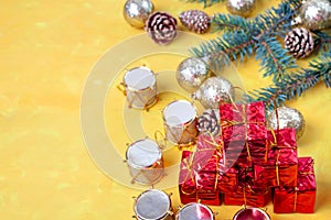 Small gift boxes in a stack on the table, drums and golden balls