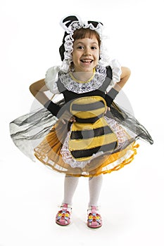 Small girl is bee costume.