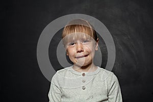 Small girl child crying over black background