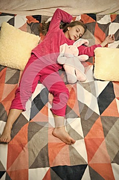 Small girl child ready to sleep. Time to relax. Childhood happiness. Pajama party. Good night. Little happy girl in