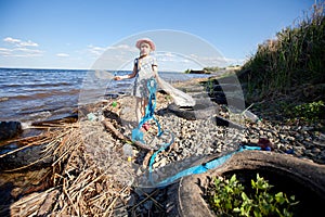 Small girl collecting rubbish