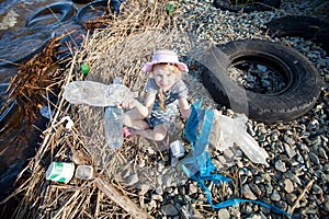 Small girl collecting rubbish