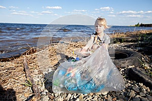 Small girl collecting rubbish