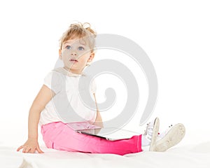 Small girl with computer tablet.