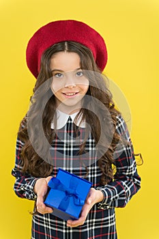 Small girl in french style hat. happy girl with long curly hair in beret. happy birthday. . Holiday gift. shopping