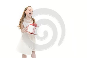 Small girl with gift box with red bow in dress.