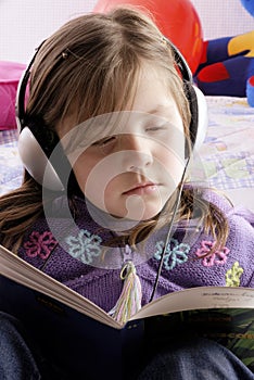 Small girl with headphones