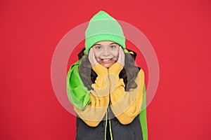 Small girl in knitted hat. looking stylish and cosy. its cold season. winter and autumn weather forecast. wear warm