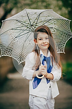 Small girl with lace umbrella