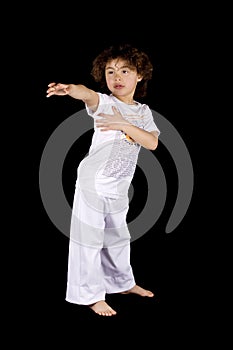 Small girl making karate hit