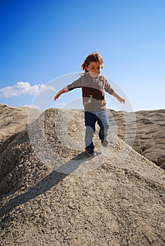 Small girl running down hill