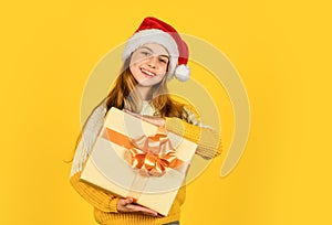 small girl santa at yellow background. xmas party celebration. happy new year. christmas shopping online. time for