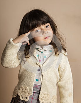 Small girl in Studio with off white background