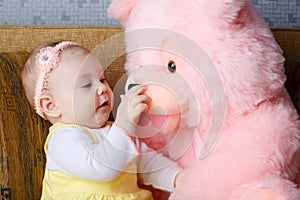 Small girl and toy bear